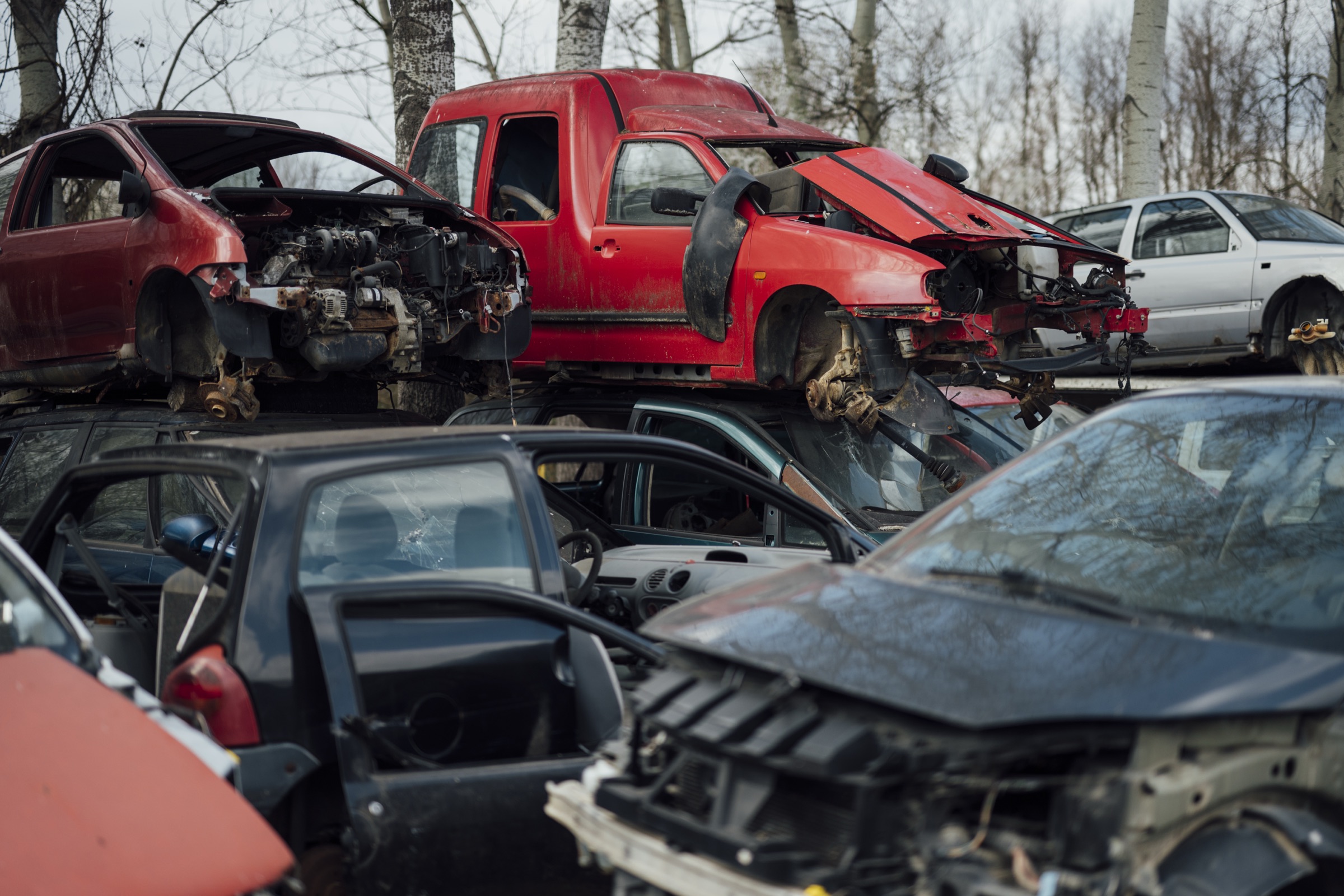 Salvage yard, cars stacked and taken apart